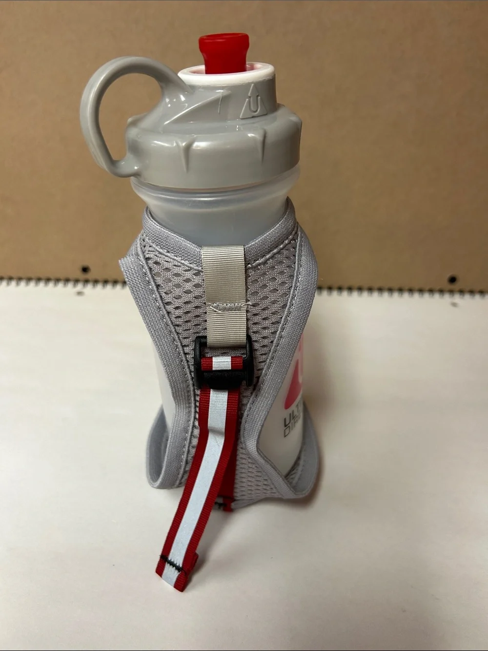 Ultimate Direction White & Red Hand Bottle with Adjustable Strap